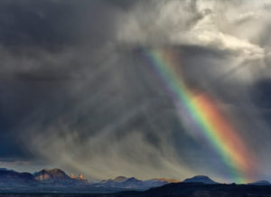a rainbow and storm showing deconstruction