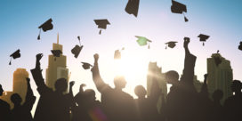 college graduation caps soaring in the sky