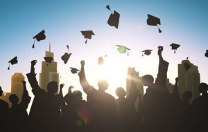 college graduation caps soaring in the sky