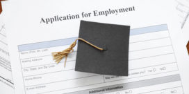Graduation cap and a job application indicating the need for life skills.