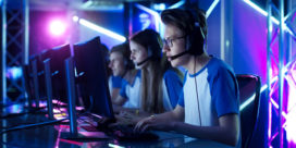 a group of kids playing esports on their computers
