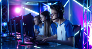 a group of kids playing esports on their computers