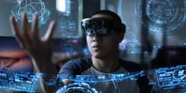 A futuristic image of a student playing with a hologram