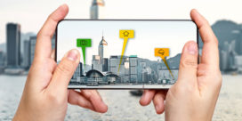 A phone held up to buildings triggers digital information that comes with augmented reality apps.