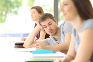 A college student looks bored, but there are ways of battling student distraction in the face of increased technology.