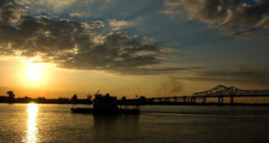 a picture of a boat at sunset