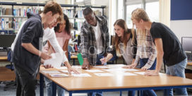 A group of college students collaborating around a table