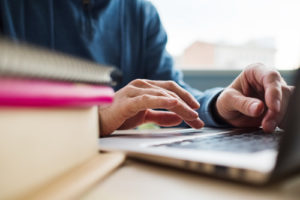 a student is working on a laptop