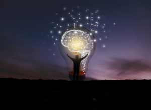 This lightbulb and brain highlight the idea of higher-ed innovation.