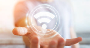 A wi-fi symbol illustrates the idea of how campus IT leaders need to know about wi-fi 6.