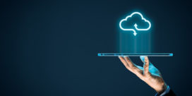 A hand holding a tablet with a cloud above to symbolize cloud computing shows how to handle challenges that may accompany a transition to Azure Active Directory.