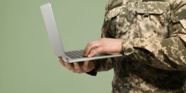 A survey of more than 30,000 military veterans shows that they value non-degree credentials--here are 4 ways to better recognize new credential pathways, like this military army veteran holding a laptop.