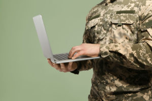 A survey of more than 30,000 military veterans shows that they value non-degree credentials--here are 4 ways to better recognize new credential pathways, like this military army veteran holding a laptop.