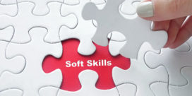 A hand holds a puzzle piece above the word "soft skills," demonstrating how essential they are for a complete education.