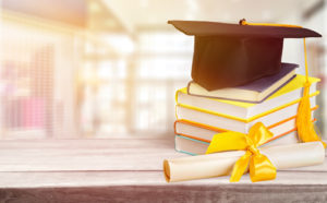 A new ranking identifies the top colleges and universities in the U.S., demonstrated by this graduation cap and diploma.